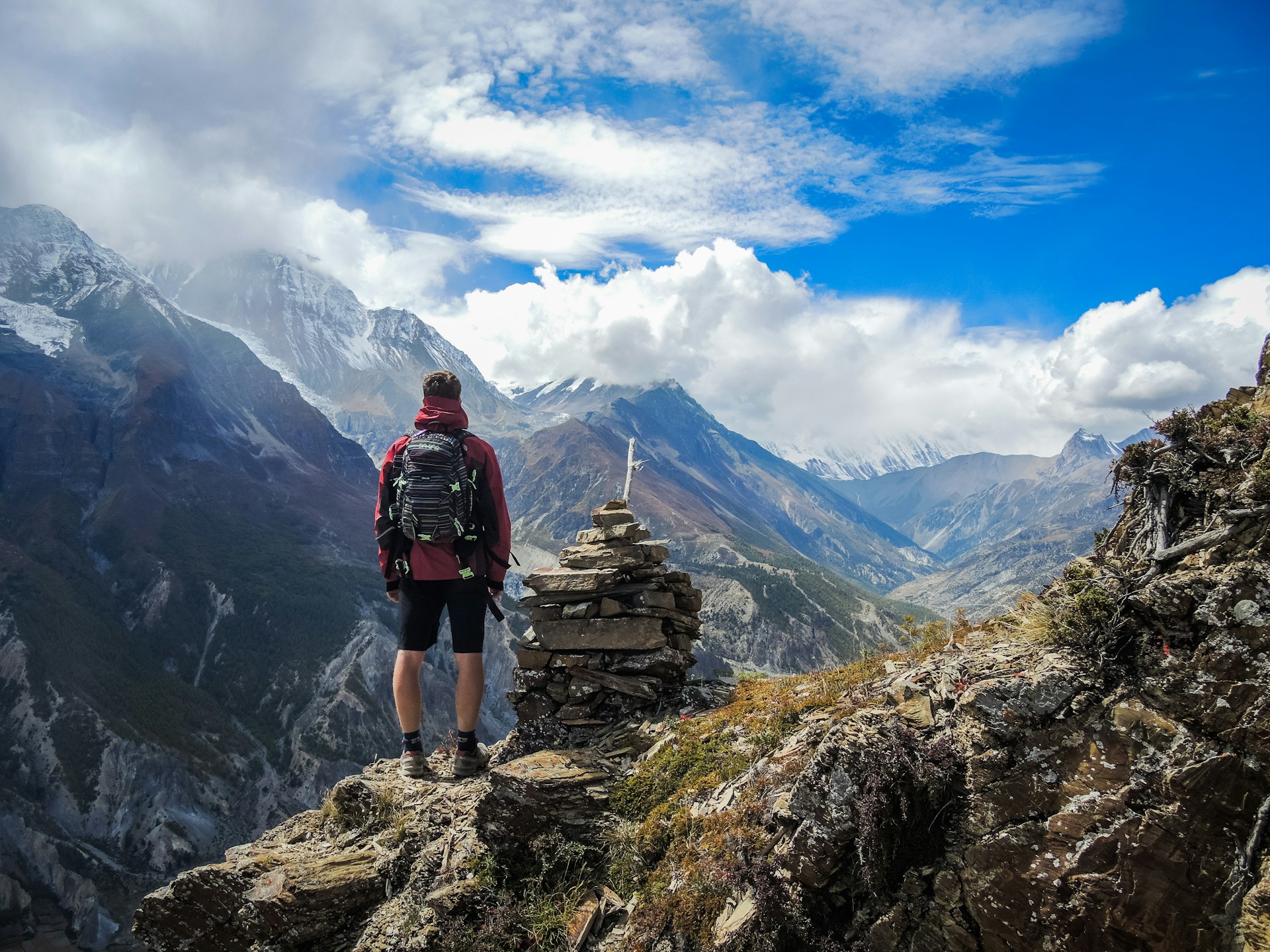 Hiker on mountain trail overlook Retry